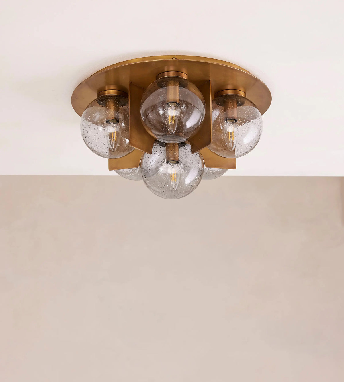 Lois flush ceiling light in antique brass and smoked bubble glass, front view