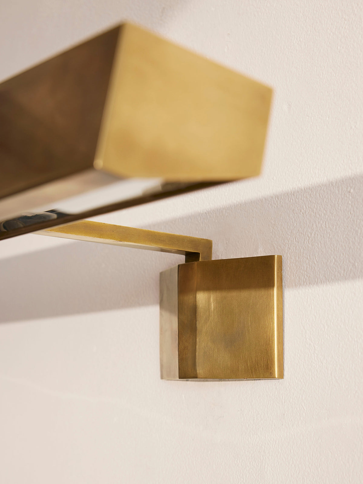 Close-up of the Enrica picture light solid brass wall bracket