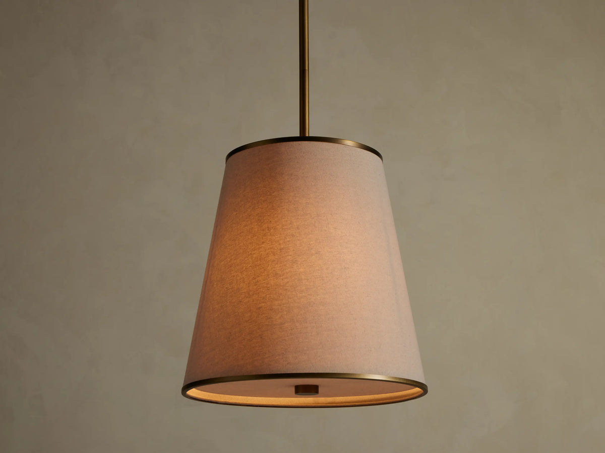 Adria Flax Pendant with tapered linen-look shade and brass-tone rim, front view