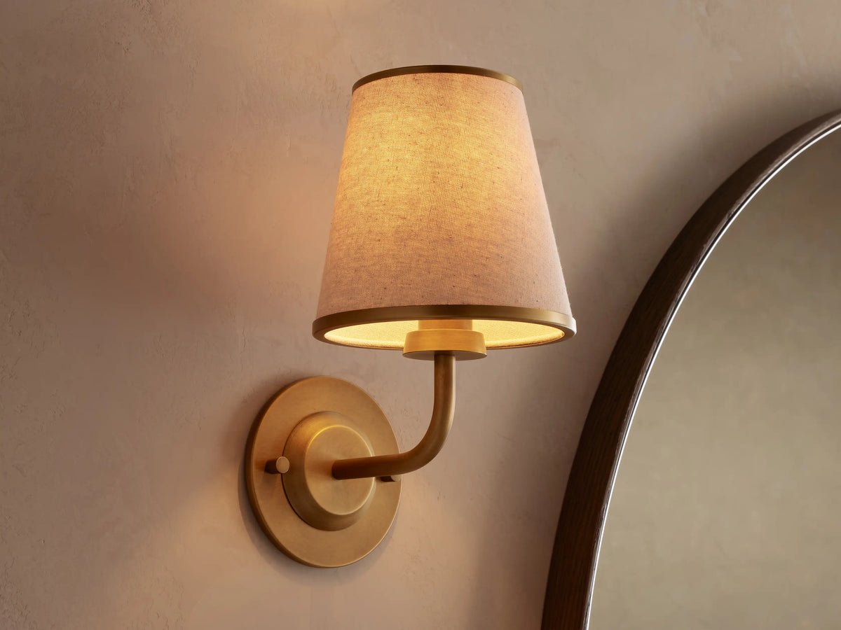Illuminated natural alabaster wall light revealing the stone veining