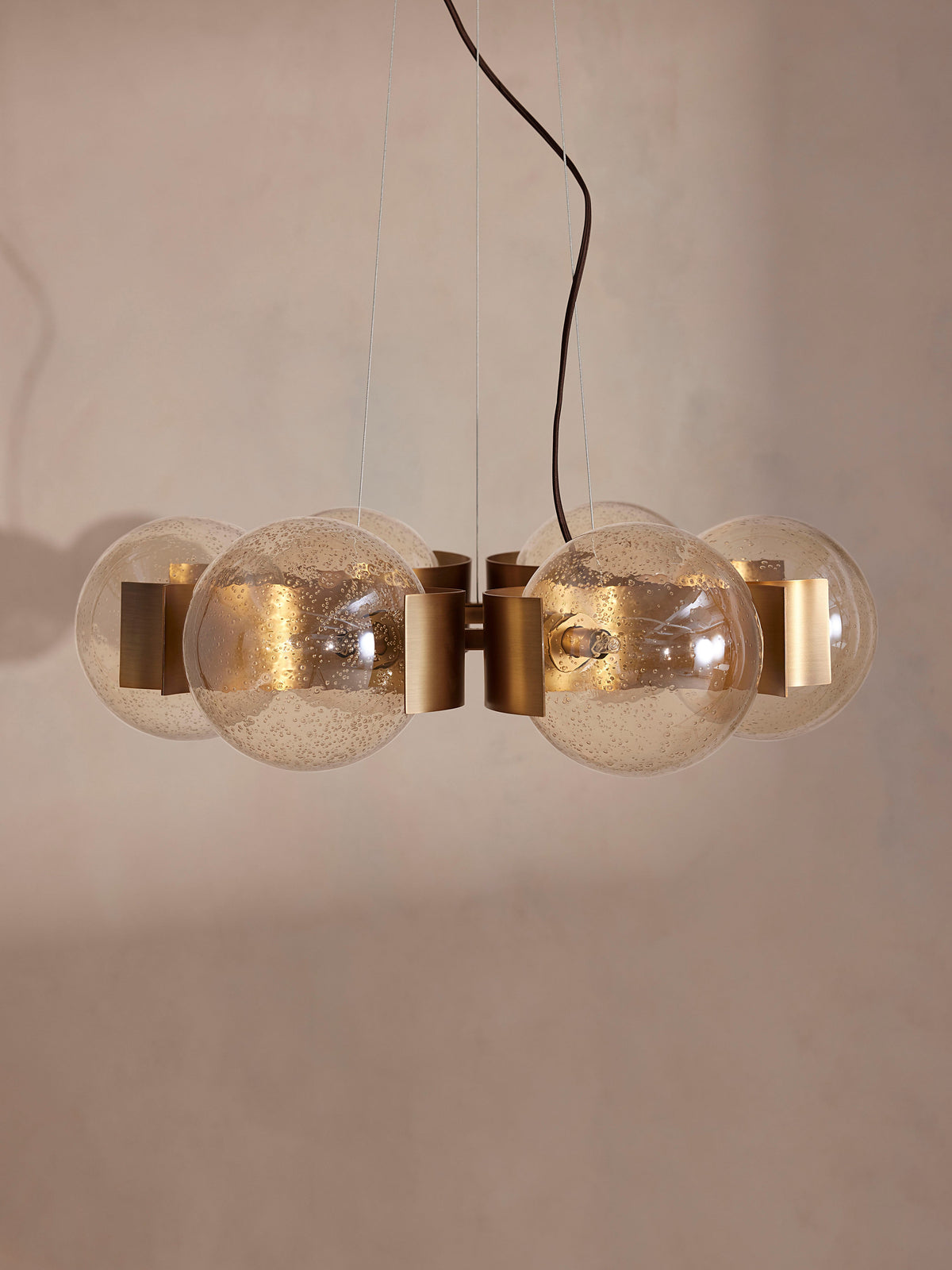 Allis chandelier with six unlit champagne glass globes, front view
