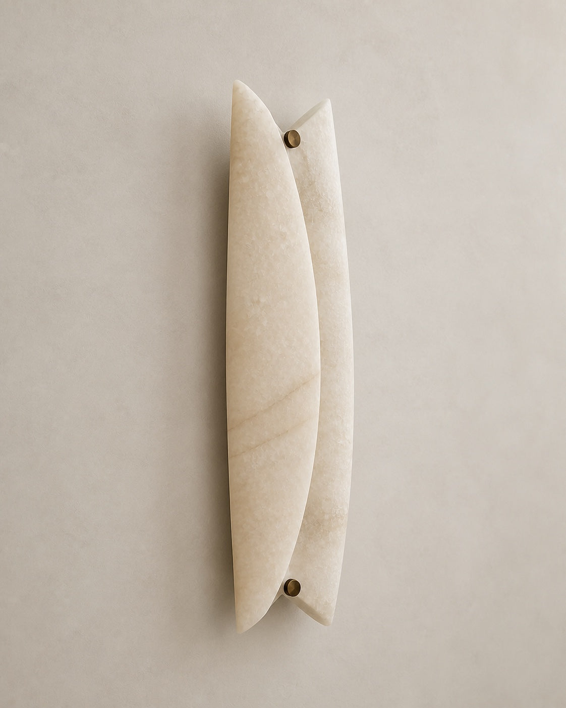 Aven alabaster wall sconce three-quarter view showing curved stone panels