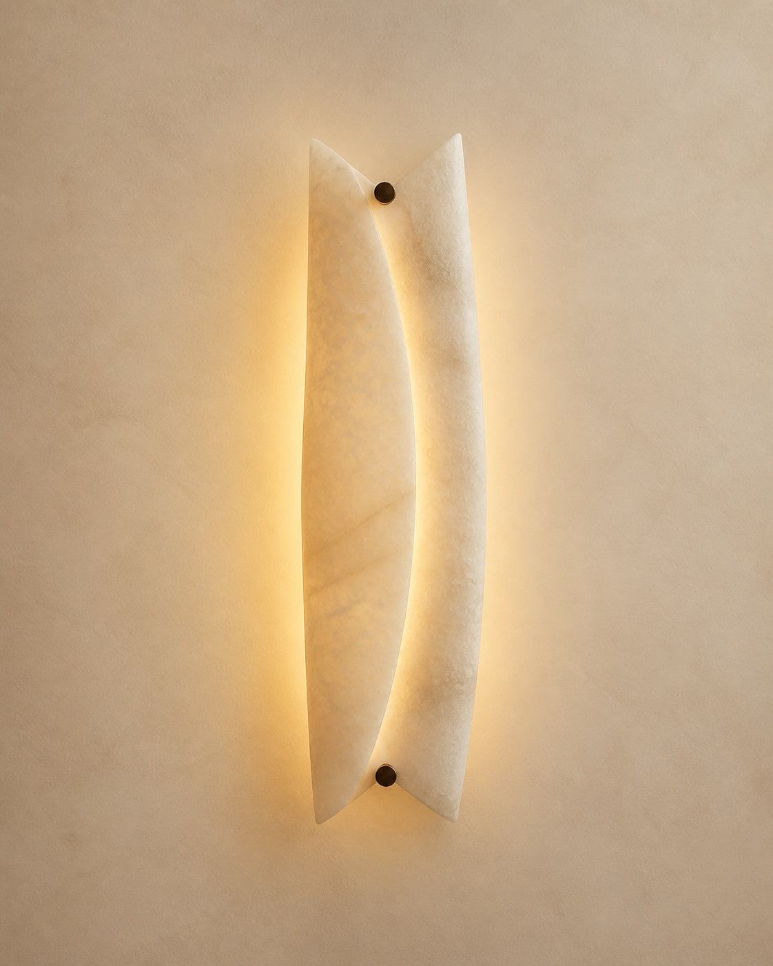Illuminated natural alabaster wall light revealing the stone veining