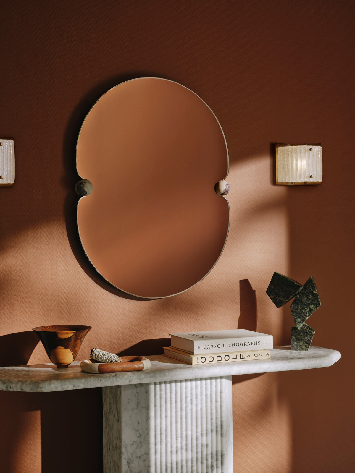 Bronte wall sconce beside a mirror