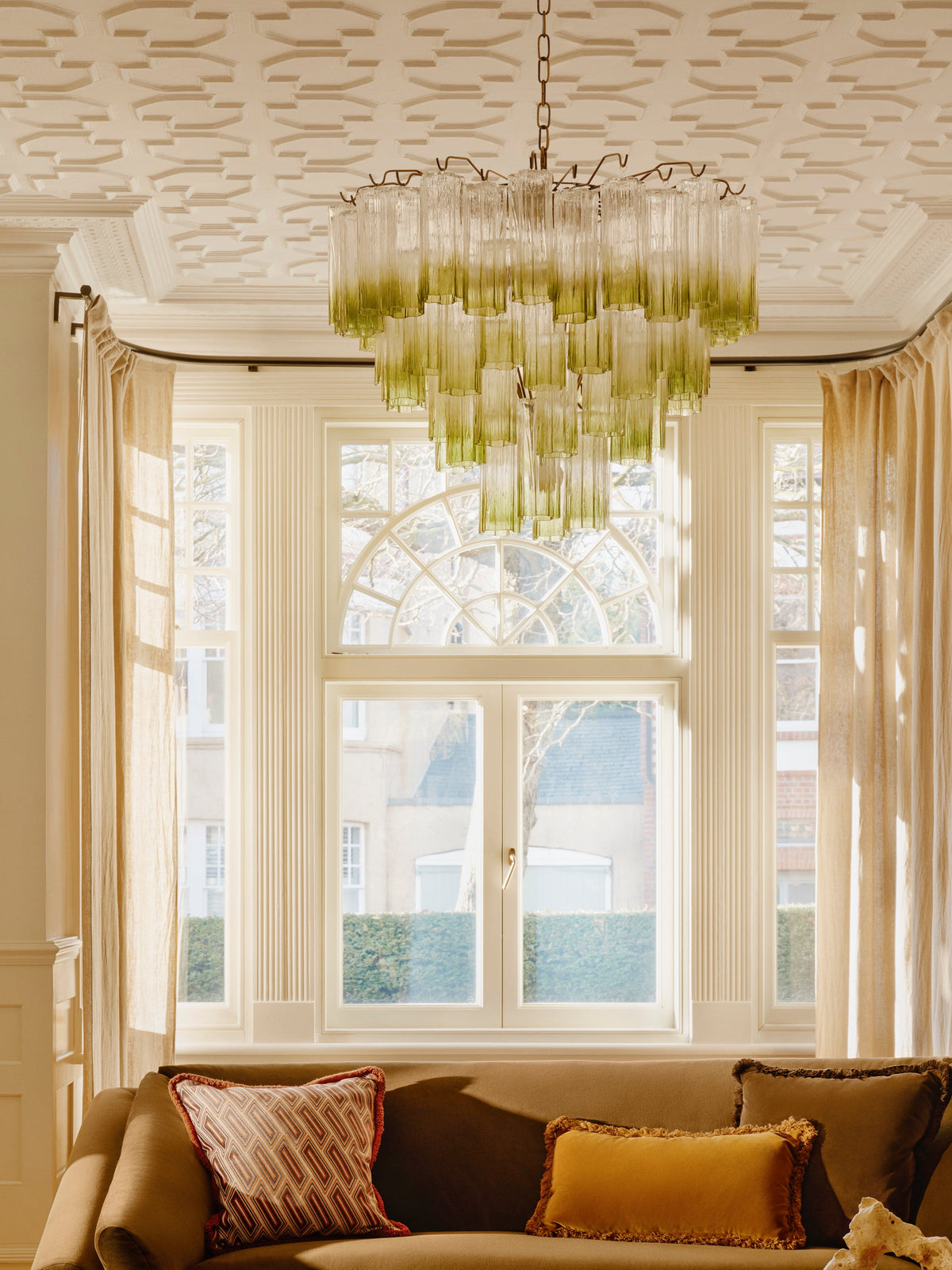 Green Chiara glass chandelier in a dining room
