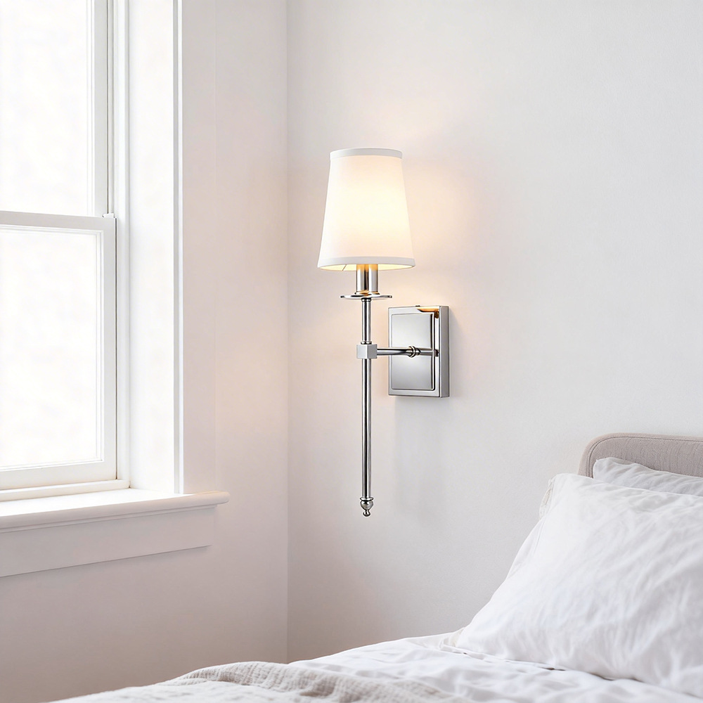 Belmont Fabric Sconce in polished nickel installed beside a bedroom window