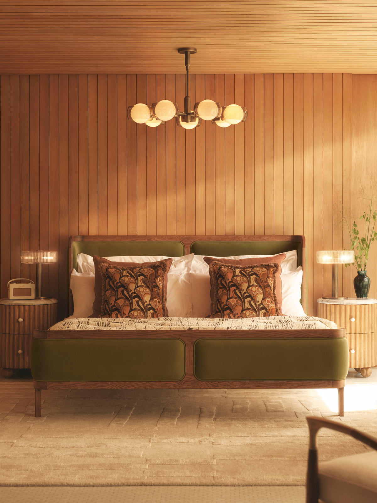 Douglas chandelier illuminating a bedroom