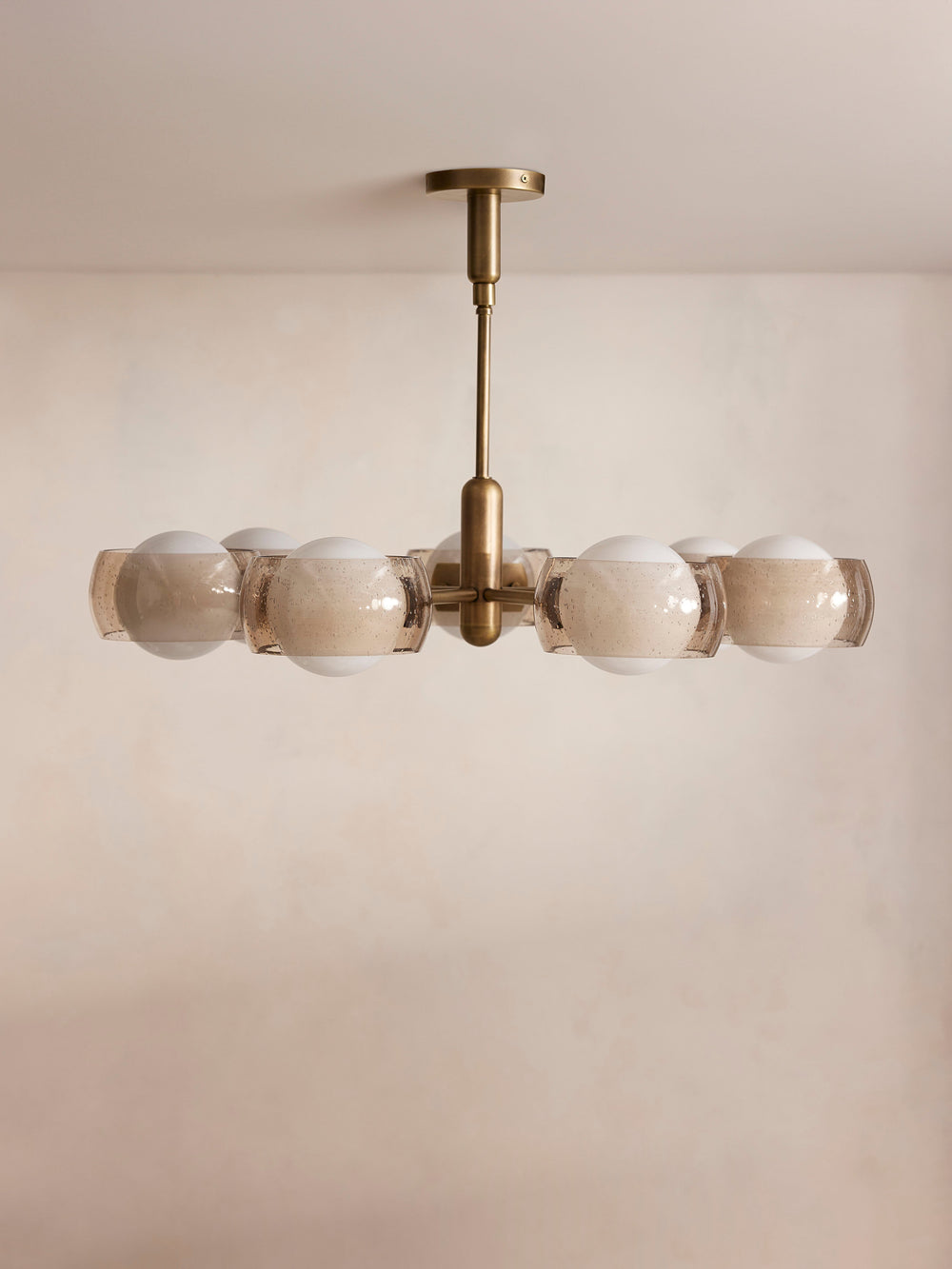 Douglas chandelier front view with seven globe lights and smoked glass shades