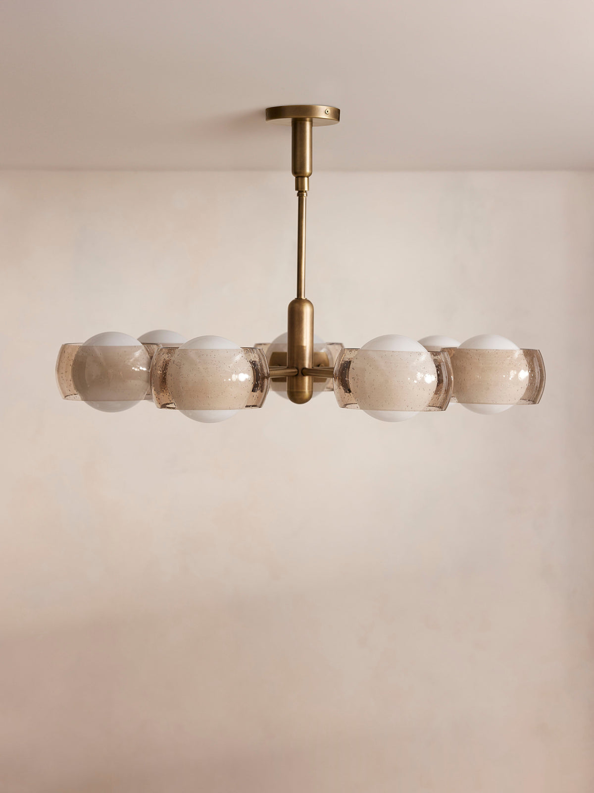 Douglas chandelier front view with seven globe lights and smoked glass shades