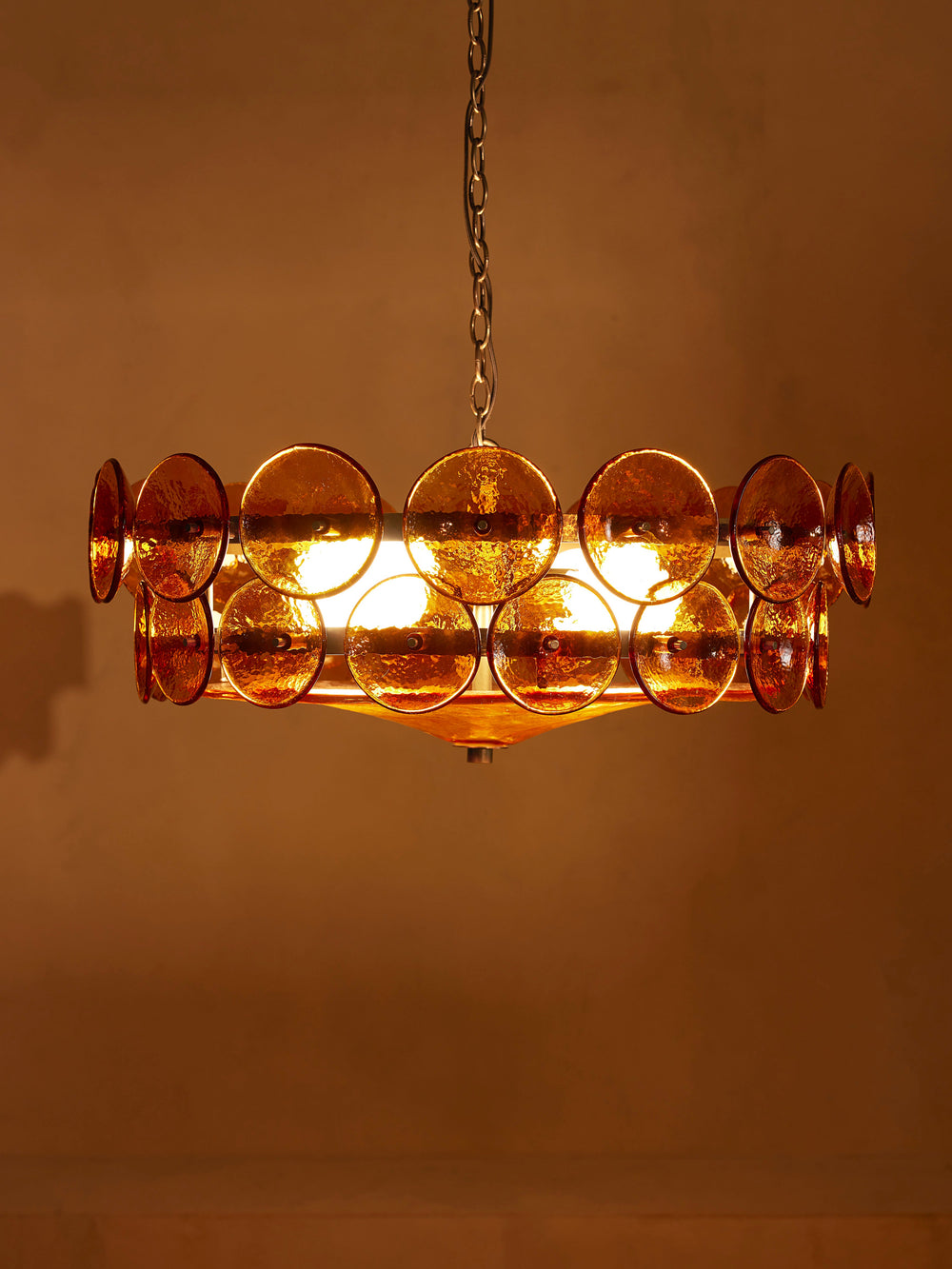 Lorenzo Amber glass chandelier with tiered antiqued brass arms, front view