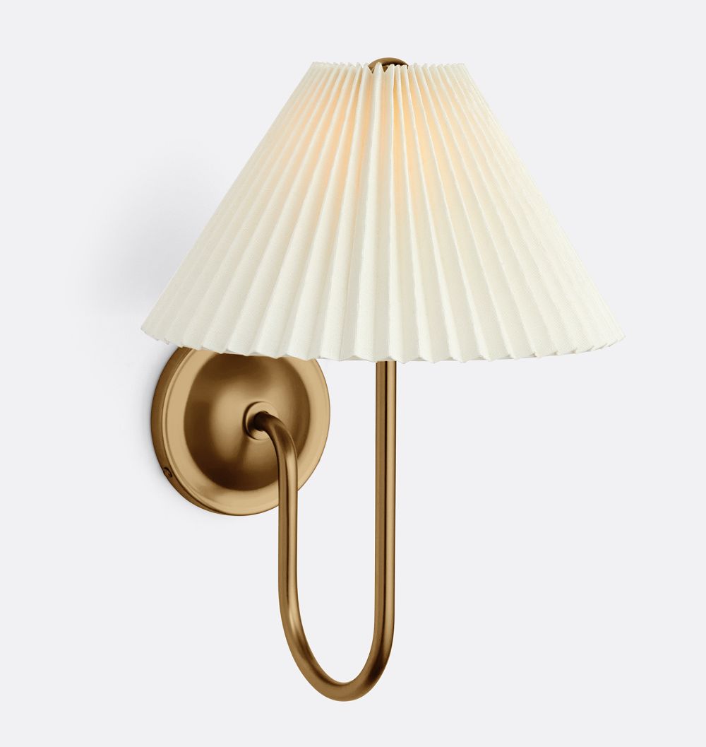 Crissey single sconce in Heritage Brass with pleated fabric shade