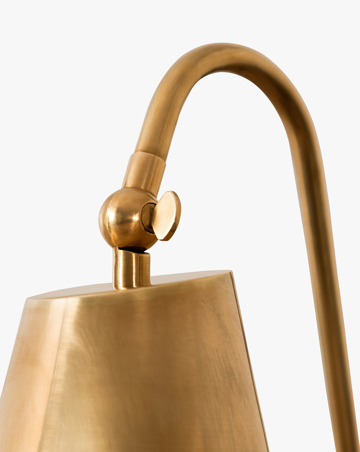 Close-up of the Saylor antique brass wall sconce adjustable shade joint