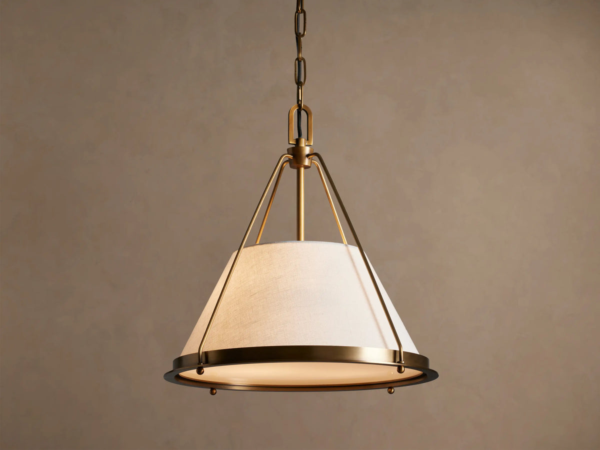 Shelton brass pendant with illuminated tapered linen shade, front view