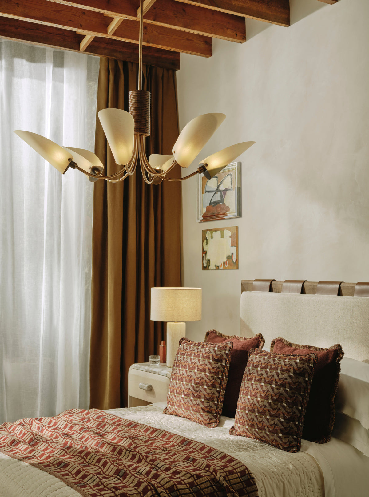 Truman chandelier in a warm bedroom interior