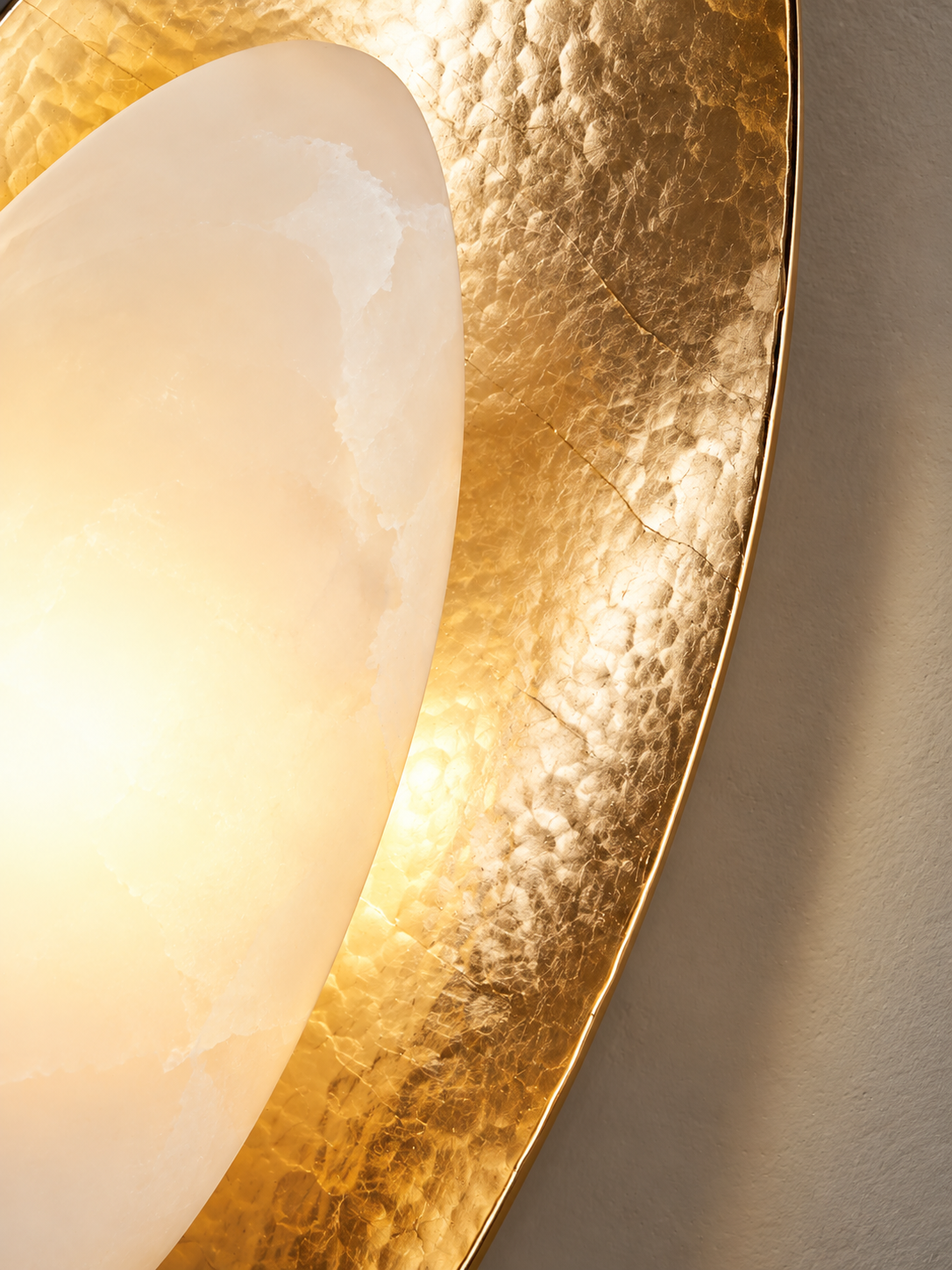 Close detail of marble shade and textured gold finish